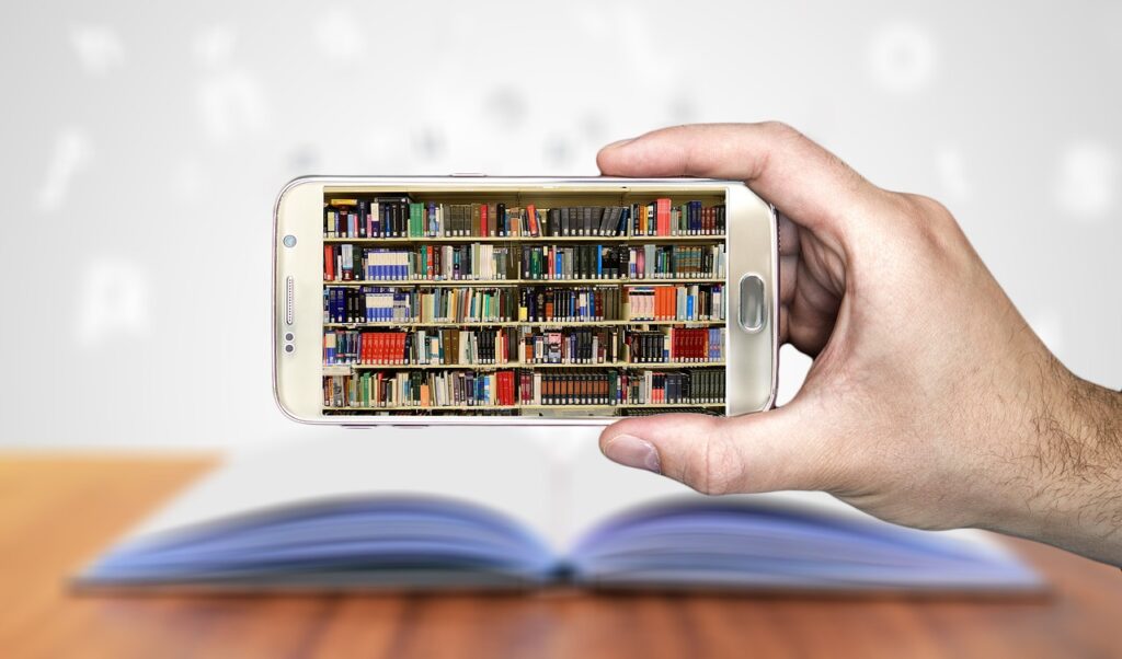 Book and smartphone showing books on library shelves