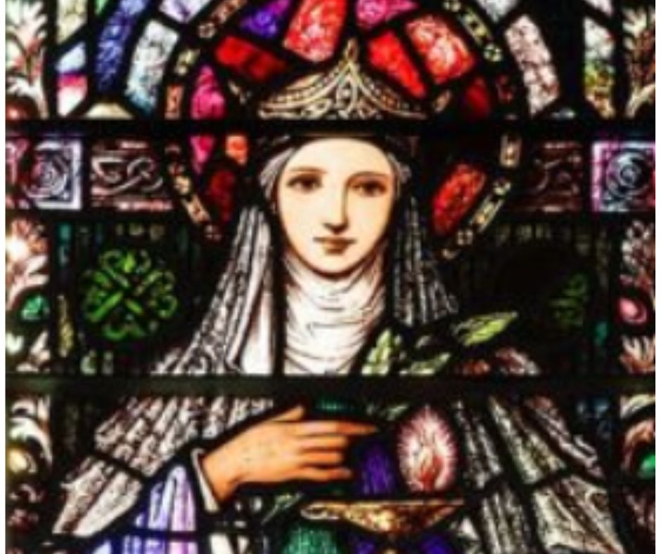 An image of Saint Brigid on a satin glass window.