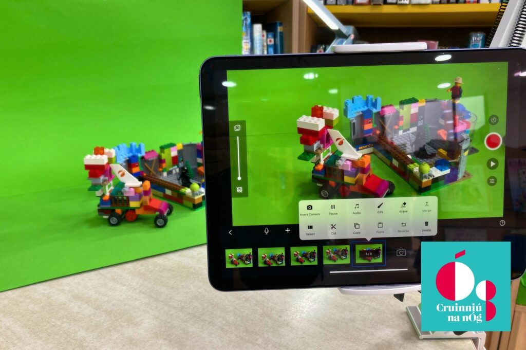 A photograph of items created out of Lego being recorded on a digital tablet.